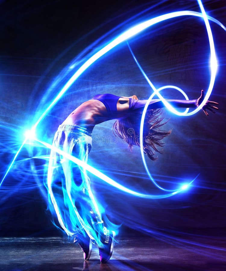 Young woman dancer. With light effects. Young woman dancer. With light effects.