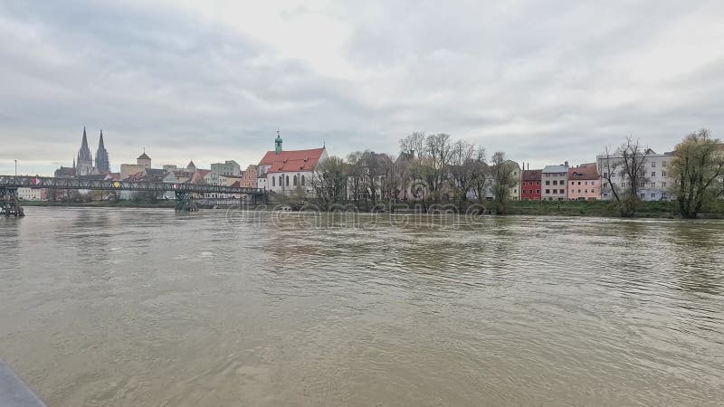 Danube river with flood water under dark cloudy