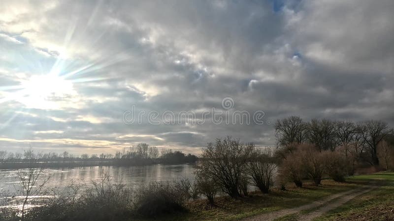 Danube river with flood water under dark cloudy