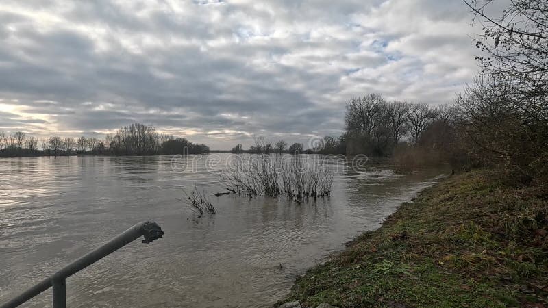 Danube river with flood water under dark cloudy