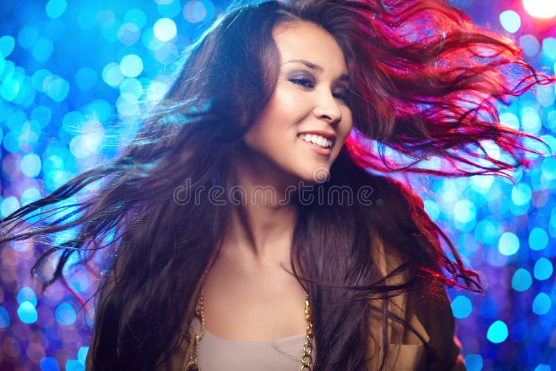 Image of a cheerful dancing girl wearing her hair untressed. Image of a cheerful dancing girl wearing her hair untressed