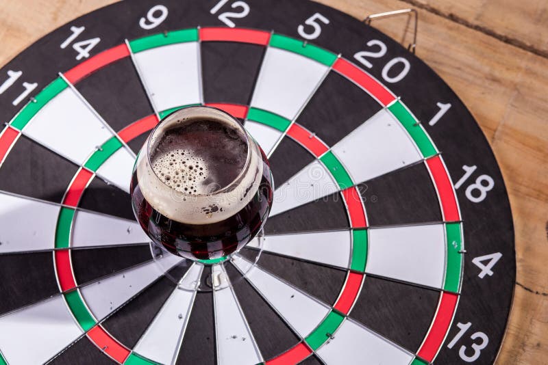 Dark ale and darts stock photo. Image of game, recreation 72457262