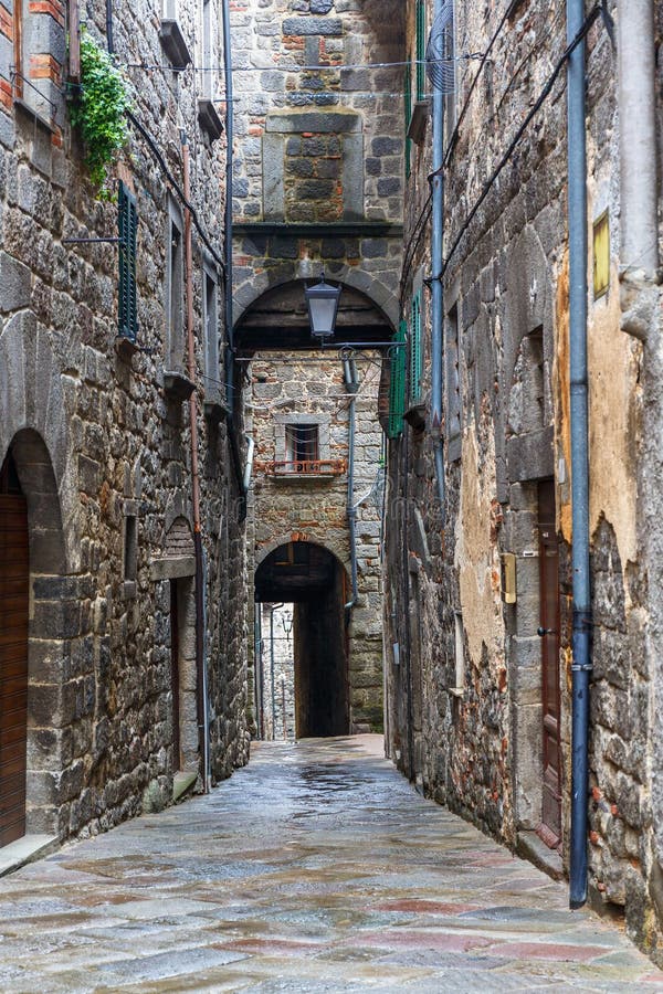 Dark alley in a picturesque old town royalty free stock photo Dark alley in a picturesque old town royalty free stock photo