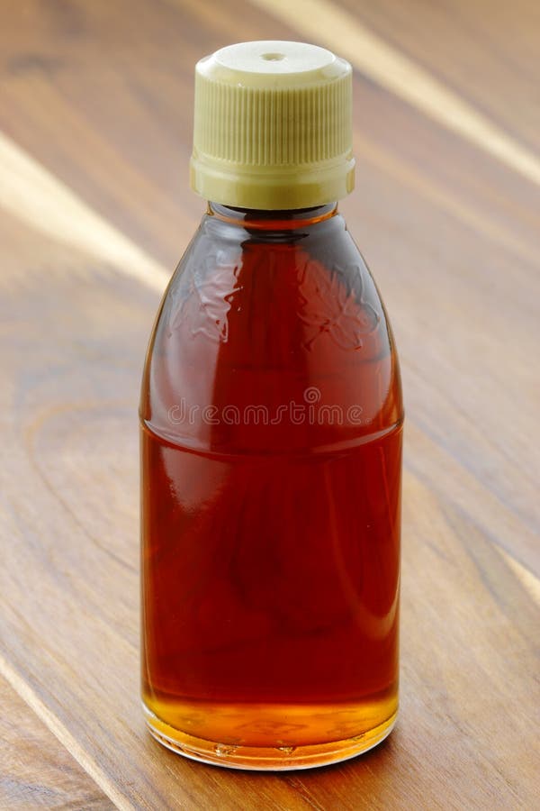 Dark amber maple syrup stock image. Image of glass, season 29147959