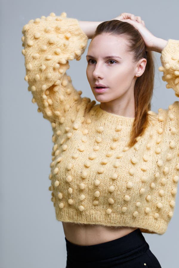 Dark blonde in knitted sweater stock photo