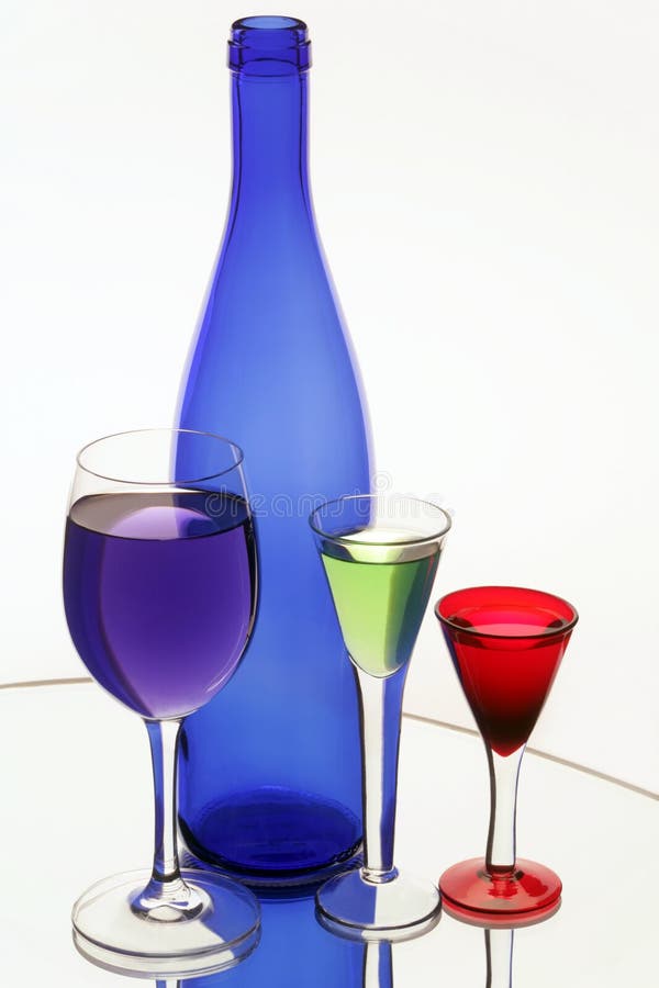 Dark blue bottle and three wine-glasses