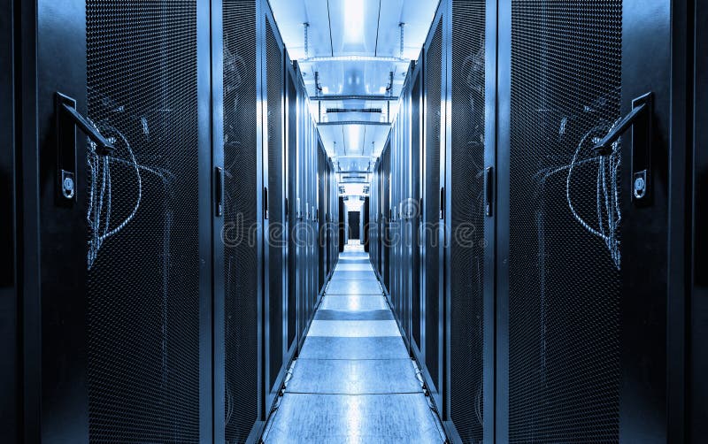 Dark blue data centre interior with rows of hardware equipment. Specialized building for hosting server and network equipment and