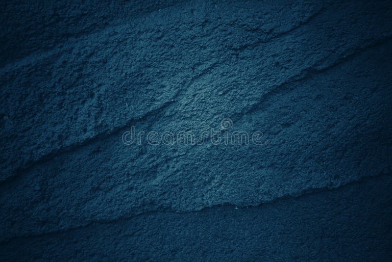 Dark blue tone background with Patterns and textures of stone stock photography