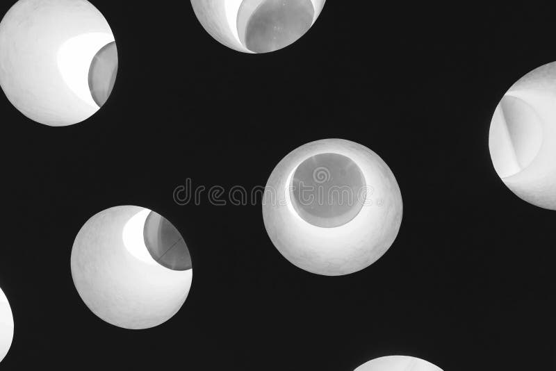 Dark ceiling with bright round windows in it, abstract photo royalty free stock photography