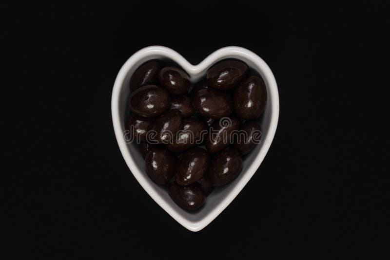 Dark Chocolate Almonds In A Heart Shaped Bowl Stock Image Image of