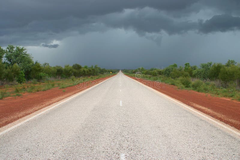 Dark clouds above the road