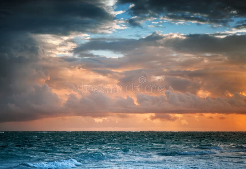 Dark colorful sunrise sky over Atlantic ocean. Dominican republic, Punta Cana. Toned photo with contrast filter effect
