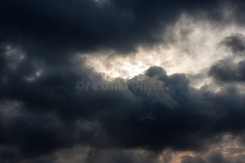 Dark dense gloomy dramatic thundercloud stock photo