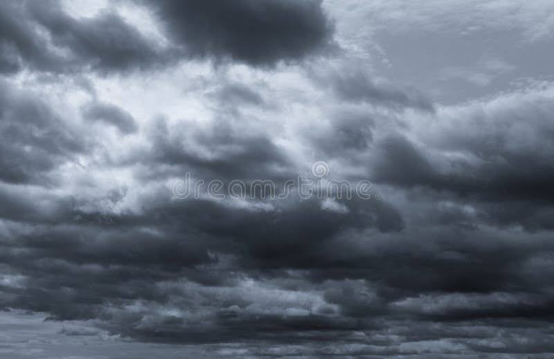 Dark dramatic sky and clouds. Background for death and sad concept. Gray sky and fluffy white clouds. Thunder and storm sky. Sad.