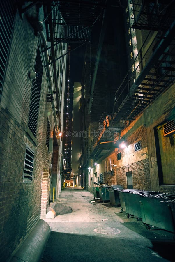 Dark and eerie downtown city alley at night