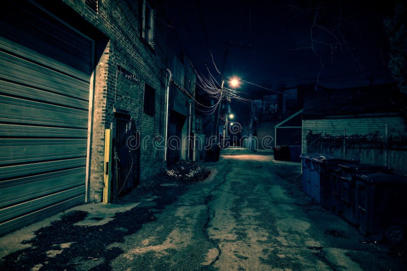 Dark empty and scary urban city street alley at night