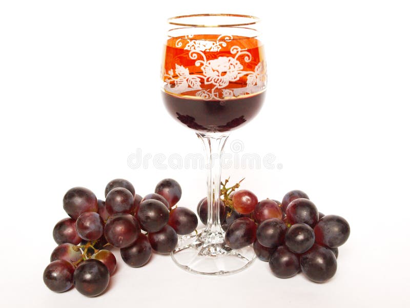 Dark grapes and a glass of wine