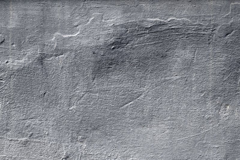 Dark gray concrete wall. Grunge background. Abstract pattern of messy painted wall. Urban dirty rough stone surface, texture. Grey