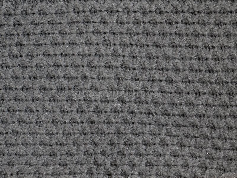 Dark gray knitted fabric stock image