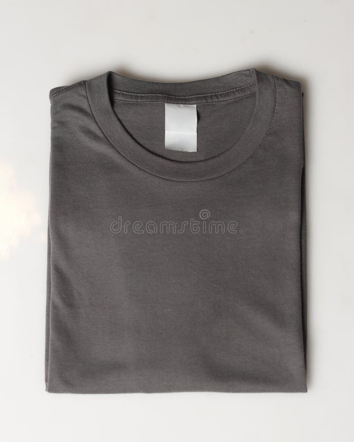 Dark gray plain t-shirt mockup template. Plain t-shirt isolated on white background. Clothing for everyday. Perfect for your ad space. Space for your logo. Plain t-shirt for everyday wear. Focus blur.