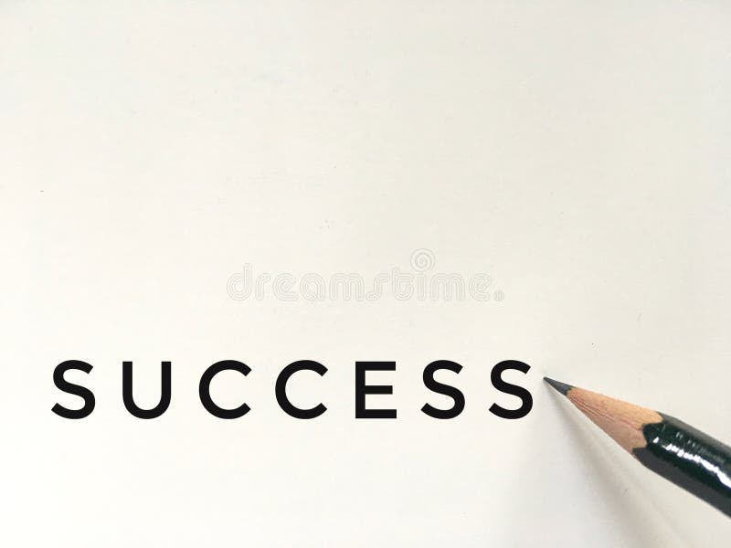 Dark green pencil on white paper with success wording stock image Dark green pencil on white paper with success wording stock image