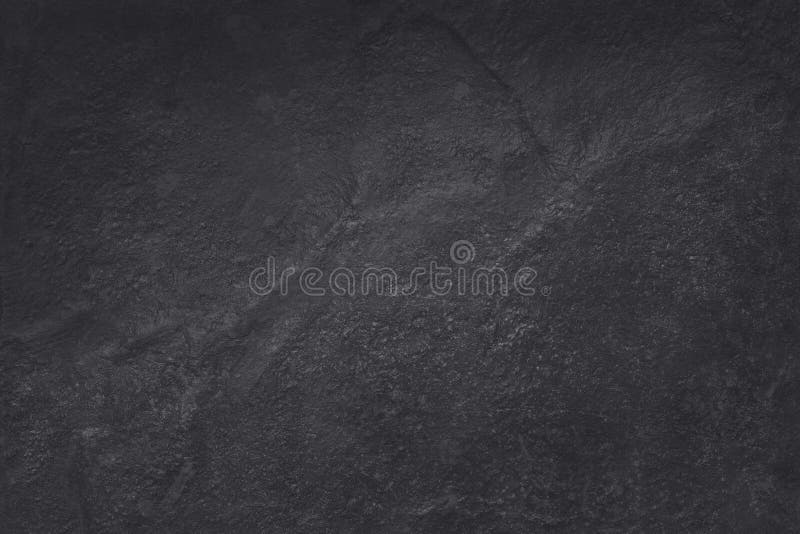 Dark grey black slate texture in natural pattern with high resolution for background and design art work. Black stone wall