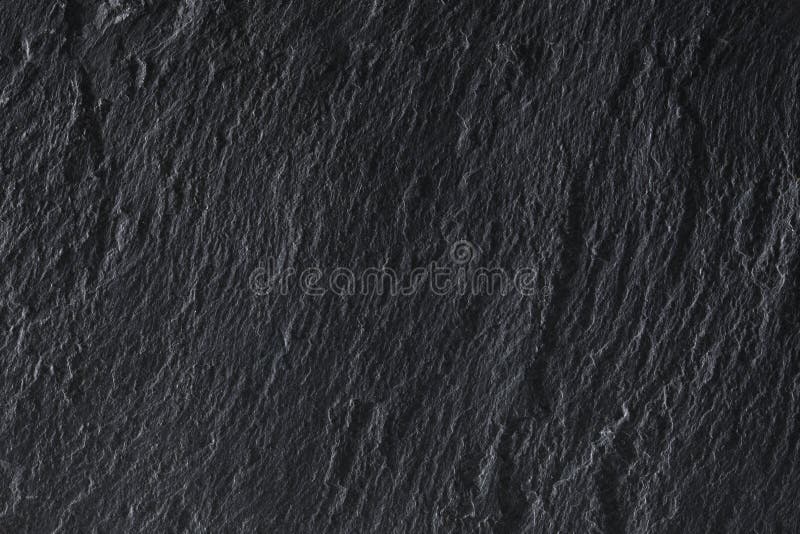 Dark grey slate background texture with copy space for your text stock photos