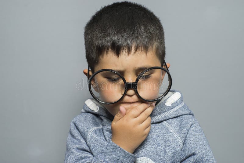 Dark-haired young student with big glasses thinking gesture