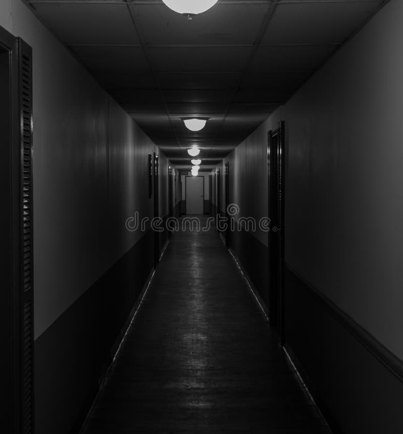 A Dark Hallway that Has Light Hanging from it S Ceiling Stock Photo