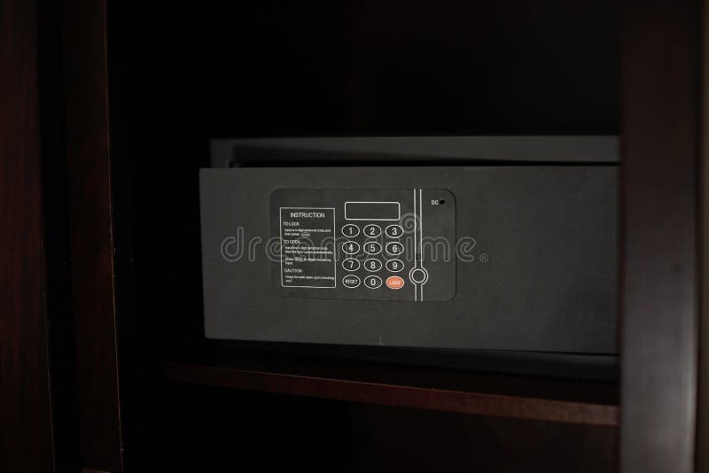 Dark Metal Safe in a Hotel Room with Instructions for Use Stock Image