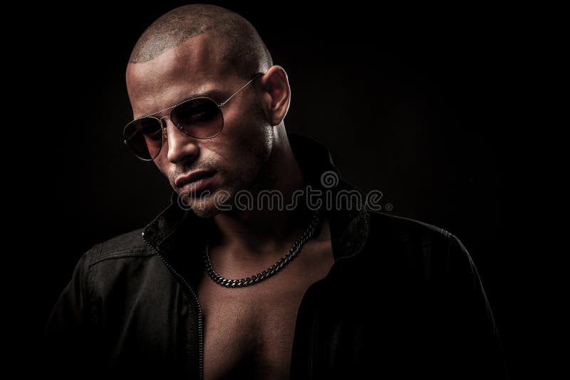 Dark photos of a mysteryous handsome young man with sunglasses royalty free stock image Dark photos of a mysteryous handsome young man with sunglasses royalty free stock image