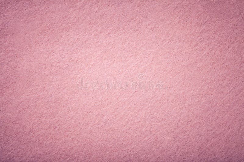 Light pink matt suede fabric closeup. Velvet texture of felt