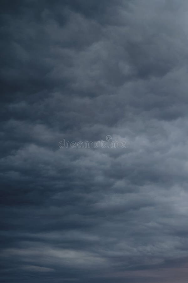 Dark Rain Clouds in the Evening Sky. Dramatic Sky with an Coming Cloudy