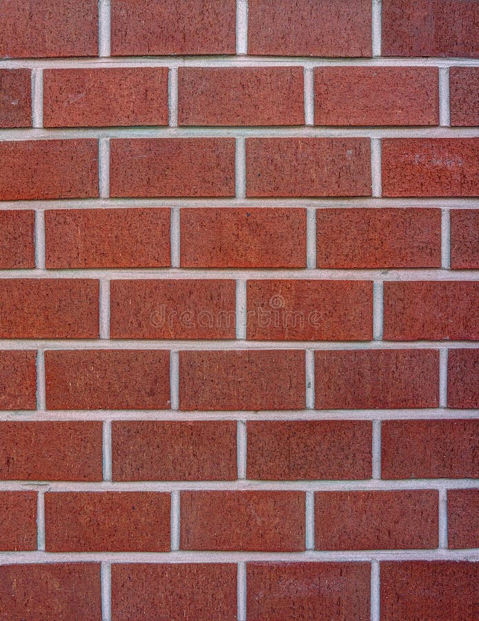 Dark red block brick wall stock image. Image of clay 34392751