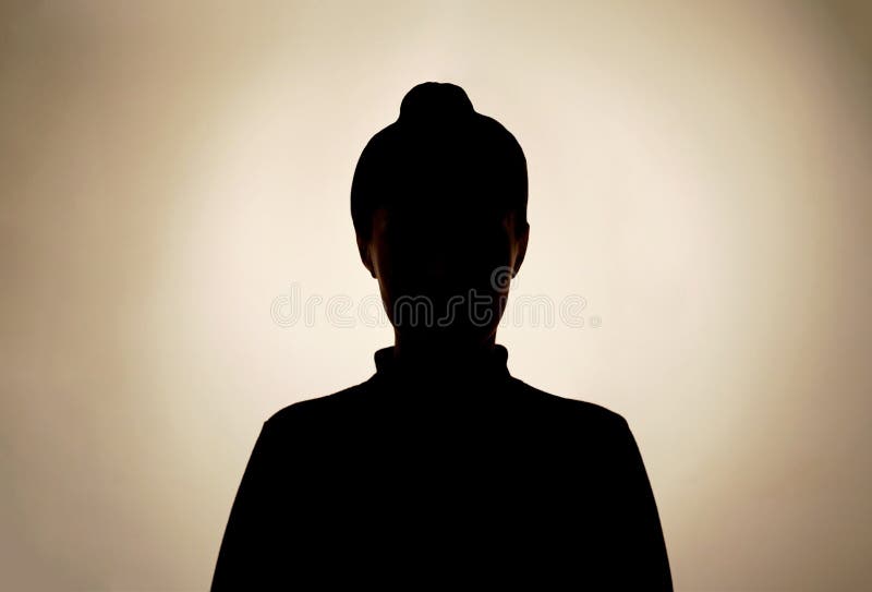 Dark silhouette of young girl on gray background, concept of anonymity.