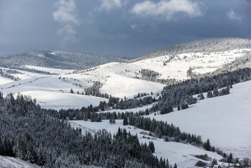 Dark sky over winter mountains