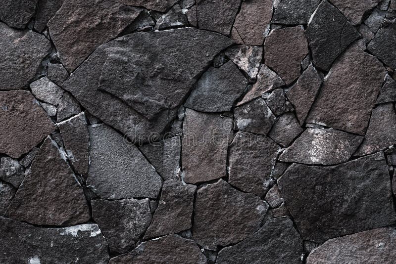 Dark stone wall background. Grey rock texture in retro style. Brick wall backgrounds. Abstract pattern. Gray stones, textured surf stock photos
