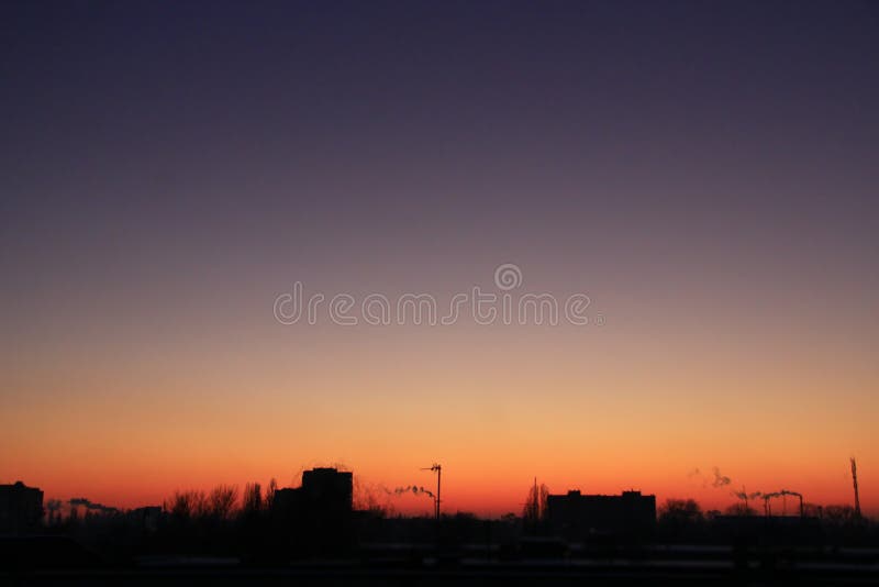 Dark sunset above multistory house. Evening cityscape stock image Dark sunset above multistory house. Evening cityscape stock image