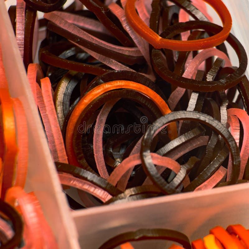 Dark Thin Rubber Bands for Hair in a Plastic Box Stock Image - Image of  abstract, accessories: 159799421