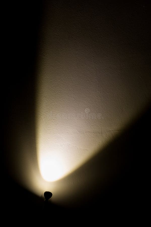 Dark Wall Illuminated From The Left Corner Spotlight Lamp Stock Photo