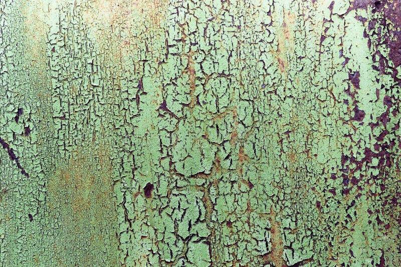 Dark worn rusty metal texture background. Old peeling paint on a metal background royalty free stock photo