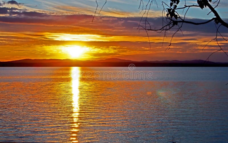 Darkening sunset sky over the lake with colorful clouds, Golden hour royalty free stock images Darkening sunset sky over the lake with colorful clouds, Golden hour royalty free stock images