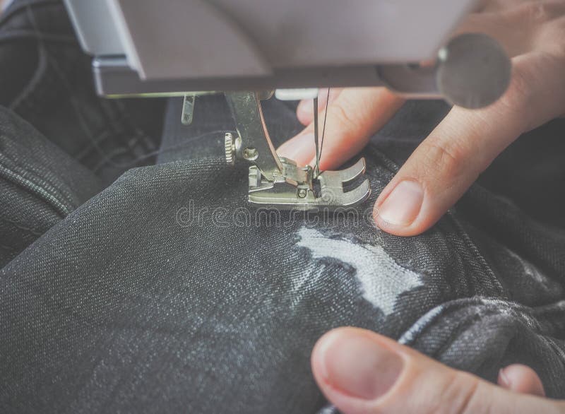 Darning Jeans on a Sewing Machine. Stock Image Image of hand, presser 114574325