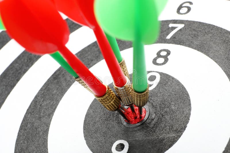 Dart board with color arrows hitting target