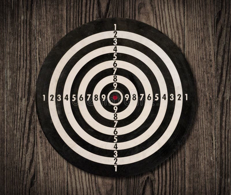 Dartboard on wooden wall, clipping path.