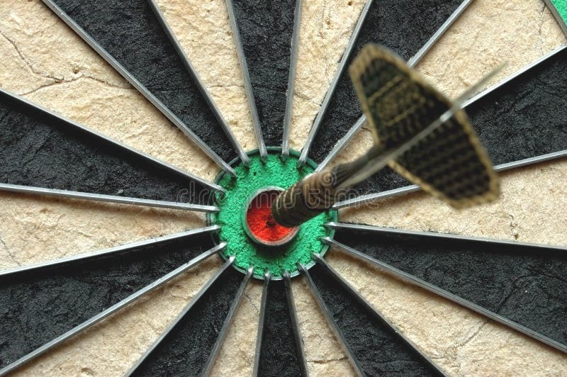 Darts arrow in the target stock images