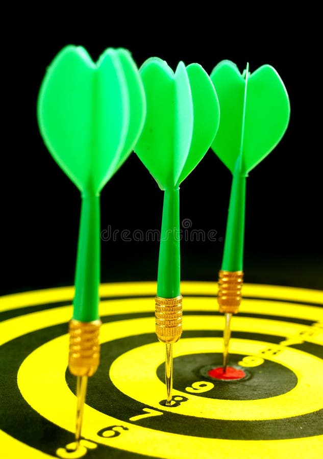 Green Dart Hitting the Center of a Target. Stock Image Image of bulls
