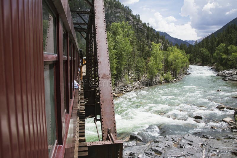 The Durango and Silverton Narrow Gauge Railroad Steam Engine travels along Animas River, Colorado, USA. The Durango and Silverton Narrow Gauge Railroad Steam Engine travels along Animas River, Colorado, USA