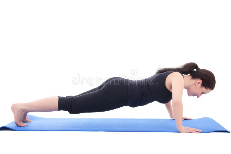 Das junge sportliche Frauenhandeln drückt die Übung hoch, die auf Weiß lokalisiert wird stockbilder Das junge sportliche Frauenhandeln drückt die Übung hoch, die auf Weiß lokalisiert wird stockbilder