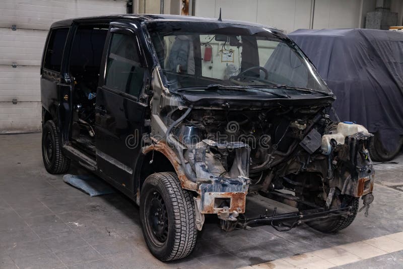 The Black Car In The Body Of The Van Is Preparing For Painting The Body With The Help Of Leveling In The Places Of Damage To The Stockfoto Bild Von Help